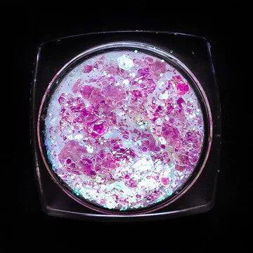 A top view of Ariel Glitter Paste from DreamSQNS on a black surface