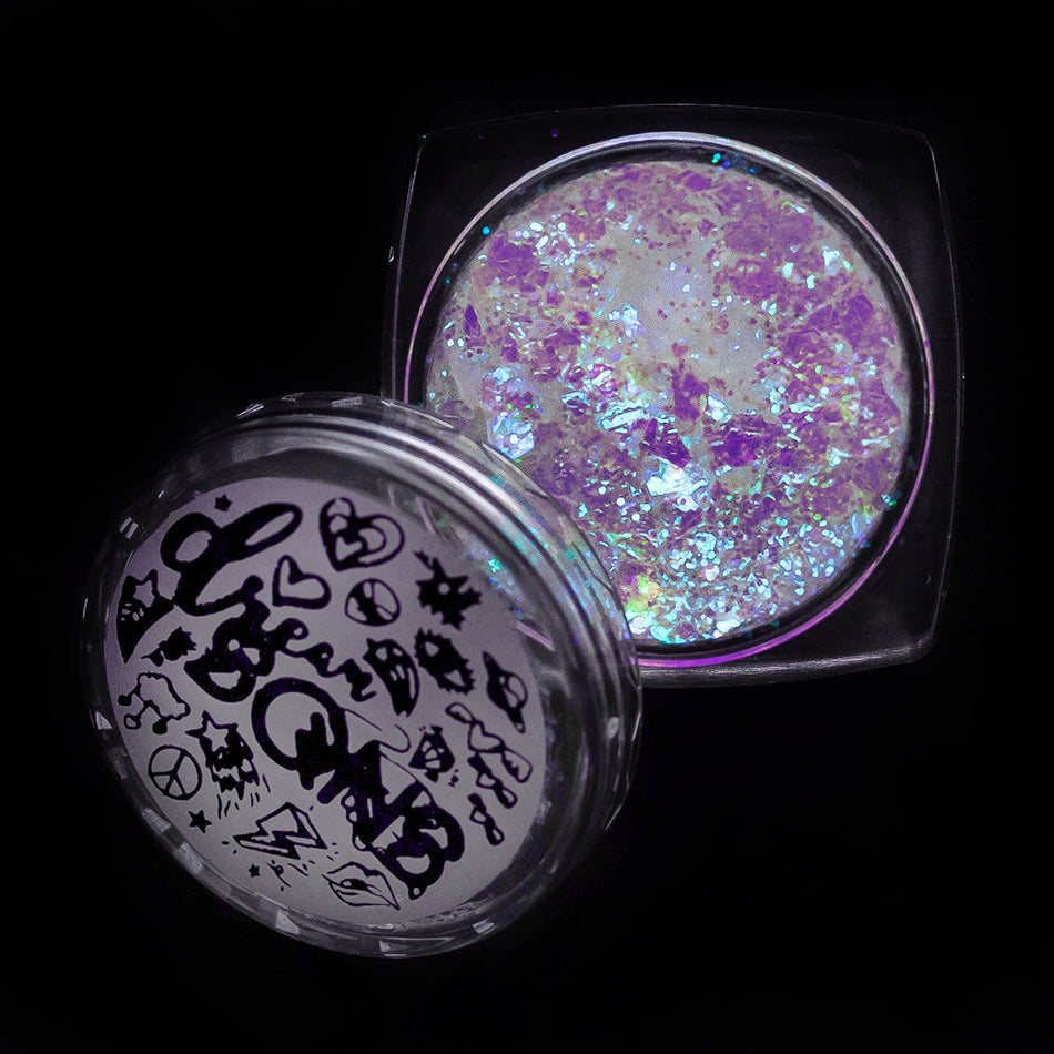A photograph of Psychic Glitter Paste from DreamSQNS in its branded component on a black background