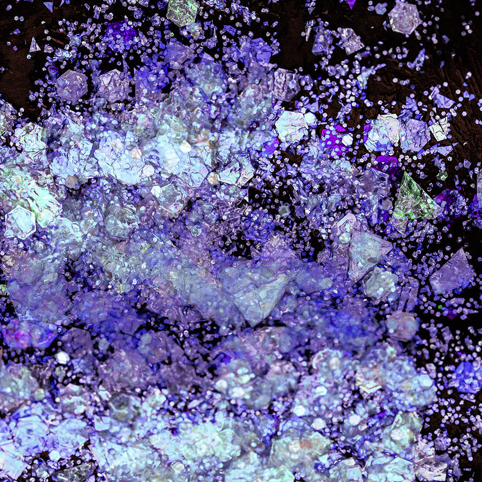 A photo of Psychic Glitter Paste from DreamSQNS spread on a black background
