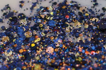 A photo of Voodoo Glitter Paste by DreamSQNS spread on a white surface