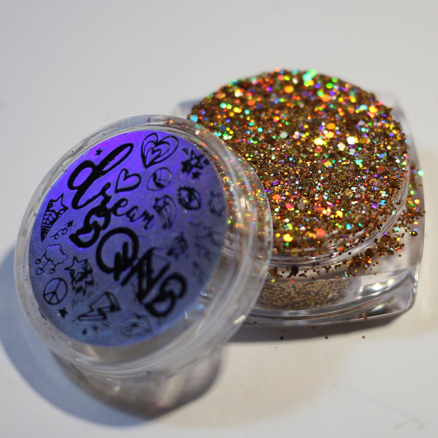 A photo of Ancient Power Holographic Glitter in its full branded component