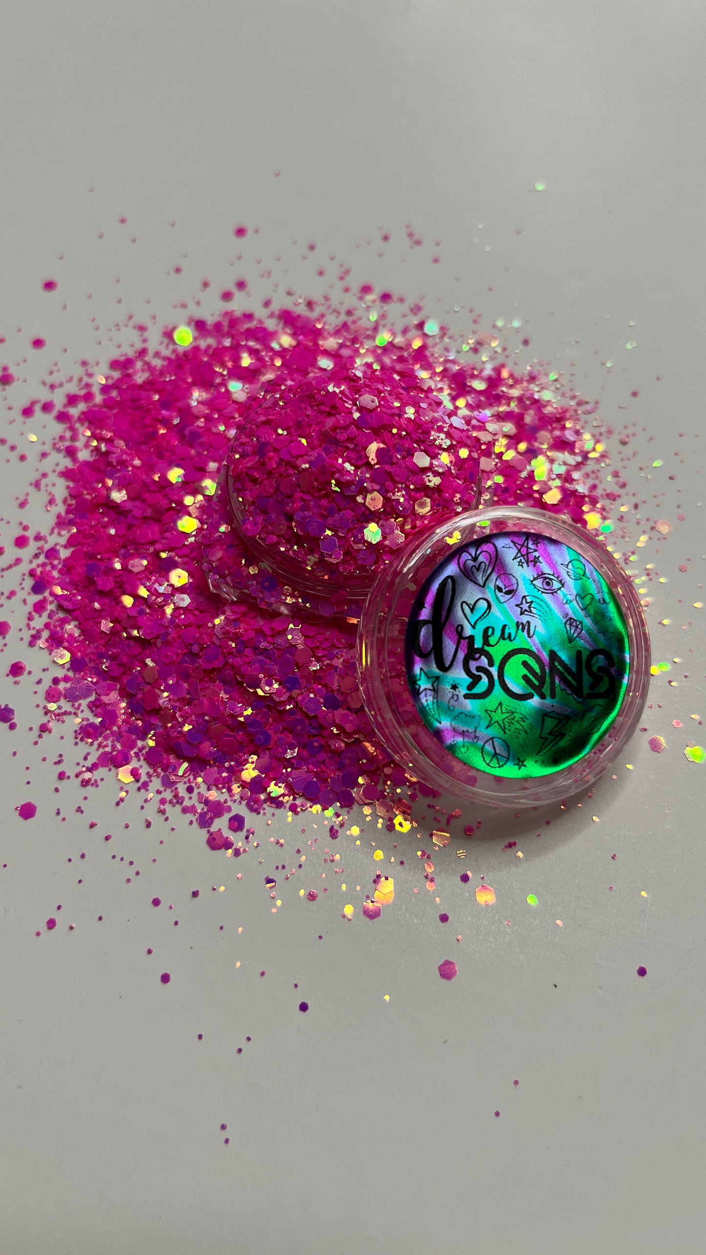 An image of Barbie Girl Chunky Glitter by DreamSQNS scattered on a white surface with the branded component