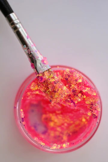 A top view of Malibu Barbie Glitter Paste from DreamSQNS on a makeup brush