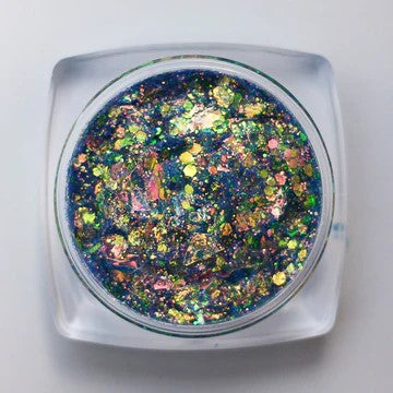 A top view of Seafoam Glitter Paste by DreamSQNS on a white platform